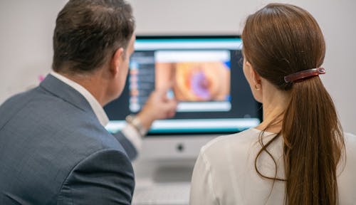 Can I have a breast reduction and implants?